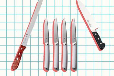 Assorted kitchen knives arranged on a grid backdrop