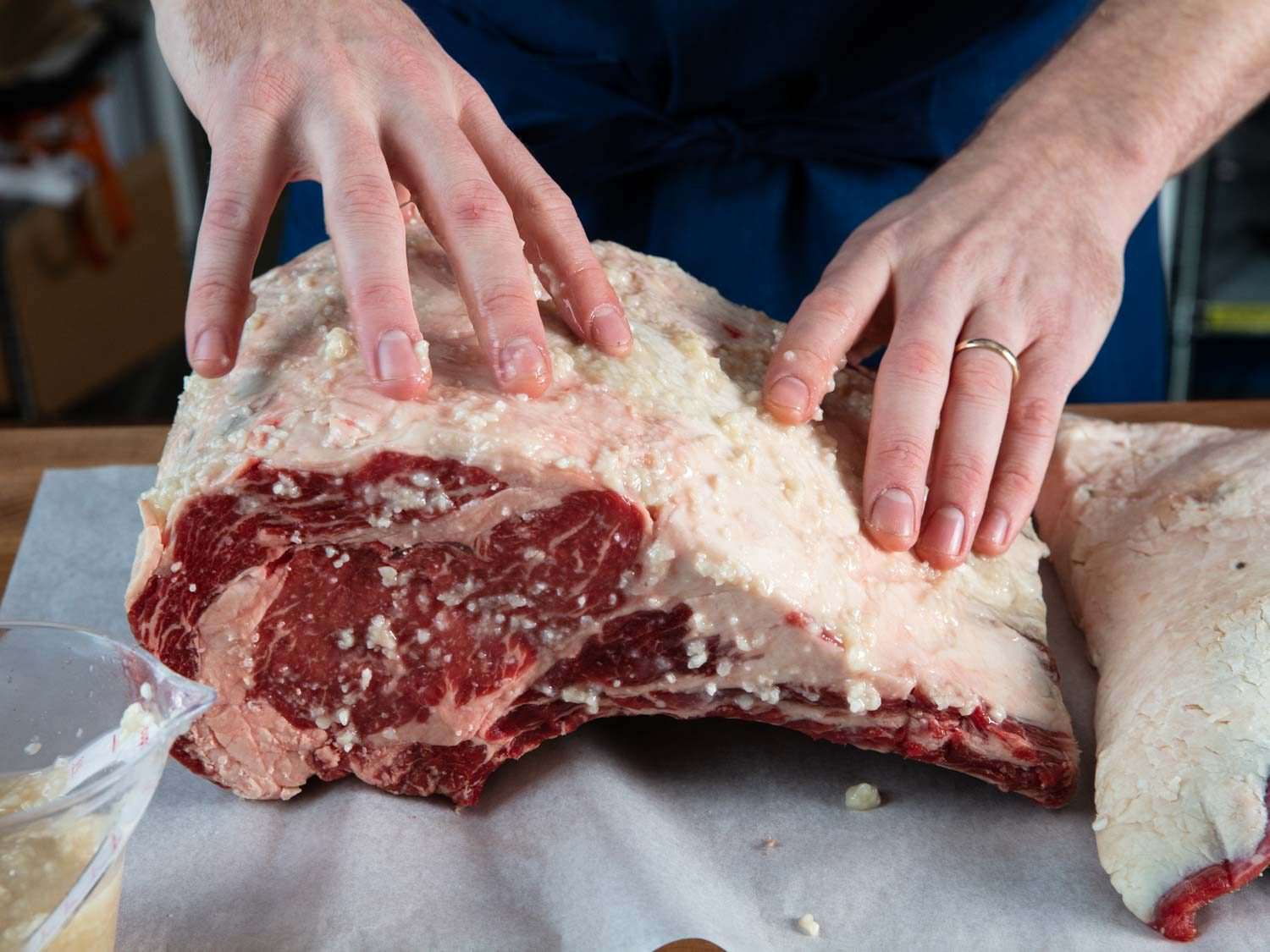 Rubbing shio koji over a prime rib roast.