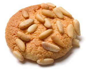 A pignoli cookie with pine nuts on top. 