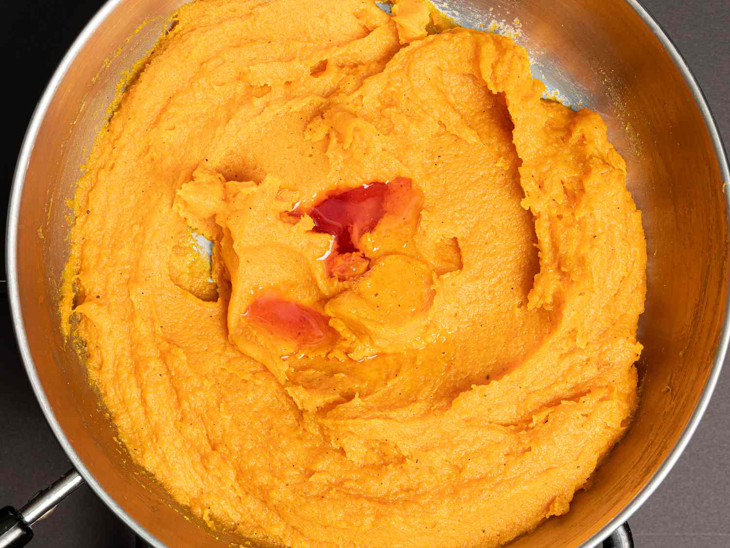 Overhead view of adding saffron