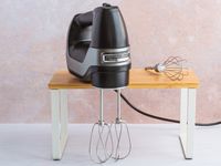 A Hamilton Beach black hand mixer. 