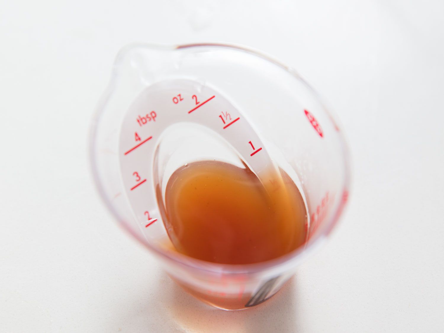 Strained wine and vinegar reduction for béarnaise.