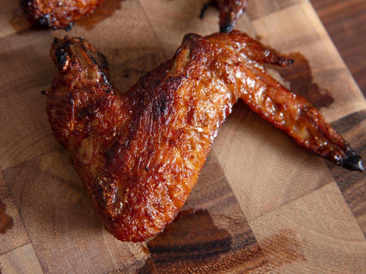 A braised and broiled chicken wing adobo.