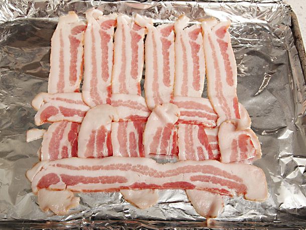 A third bacon slice is added to the weave.