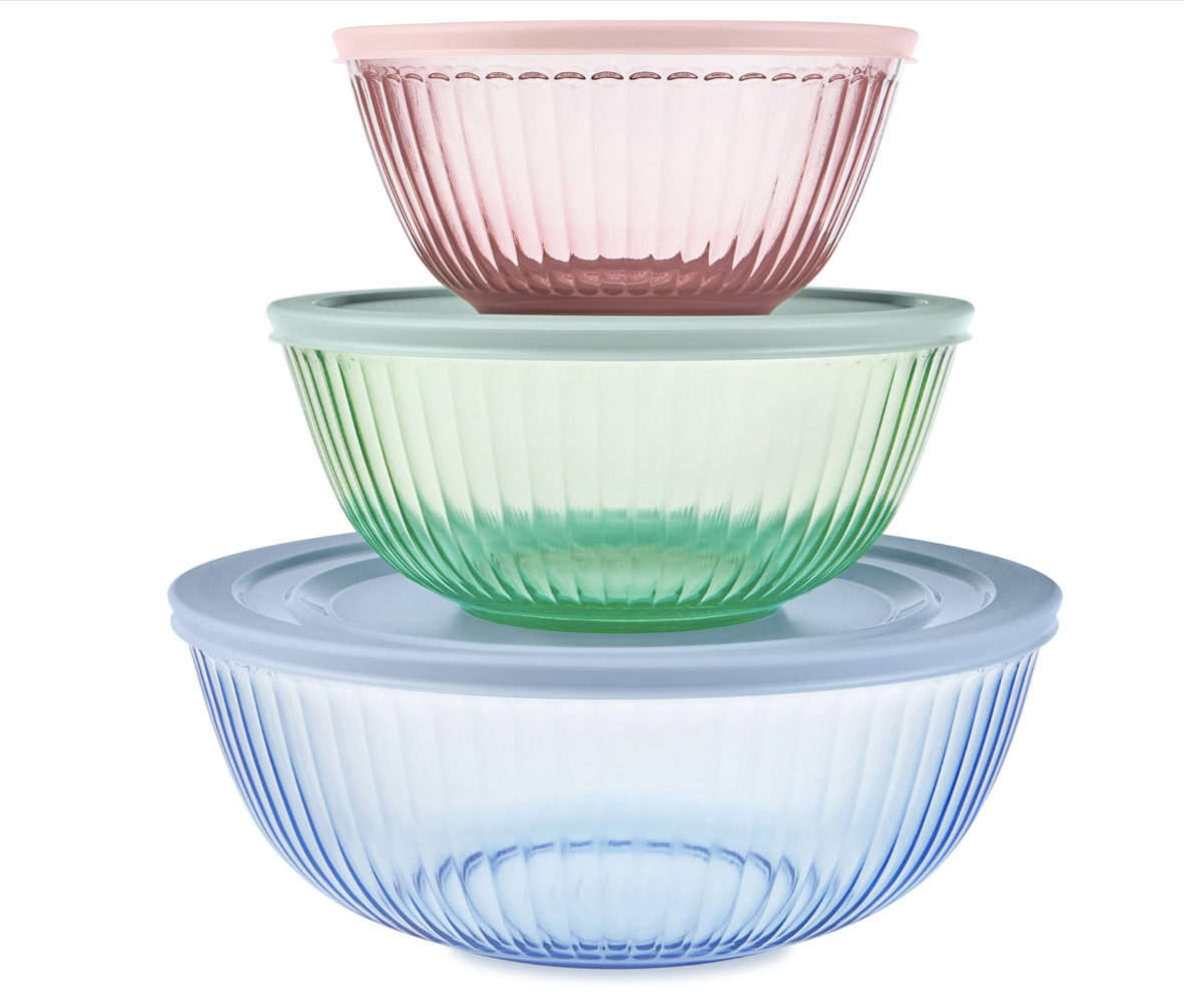 Three stacked ribbed glass bowls with lids