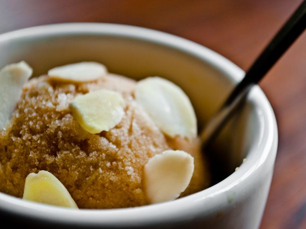 Closeup of a scoop of iced coffe and almond sherbet.