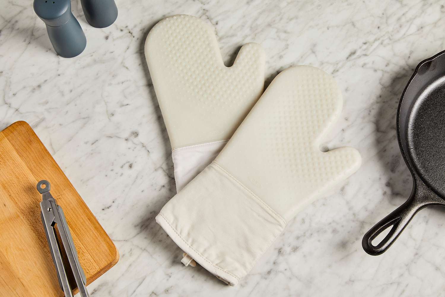OXO oven mitts on a marble surface