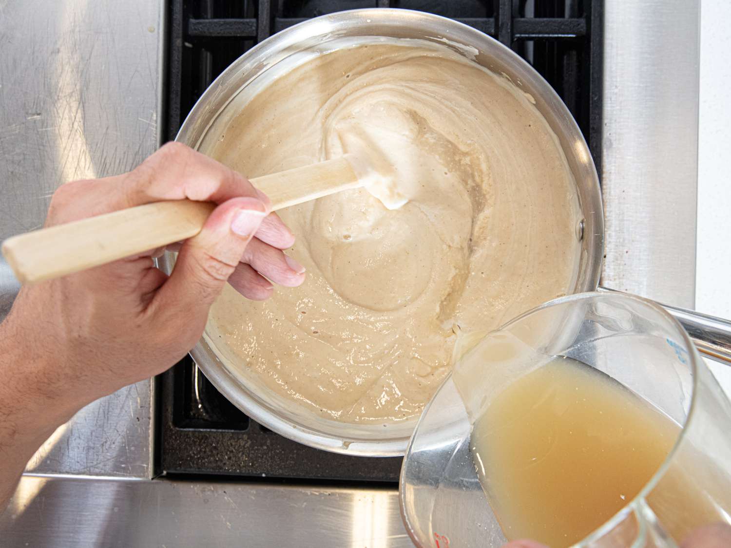 Overhead view of thinning soup