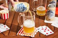 sam adams just the haze being poured into a glass 