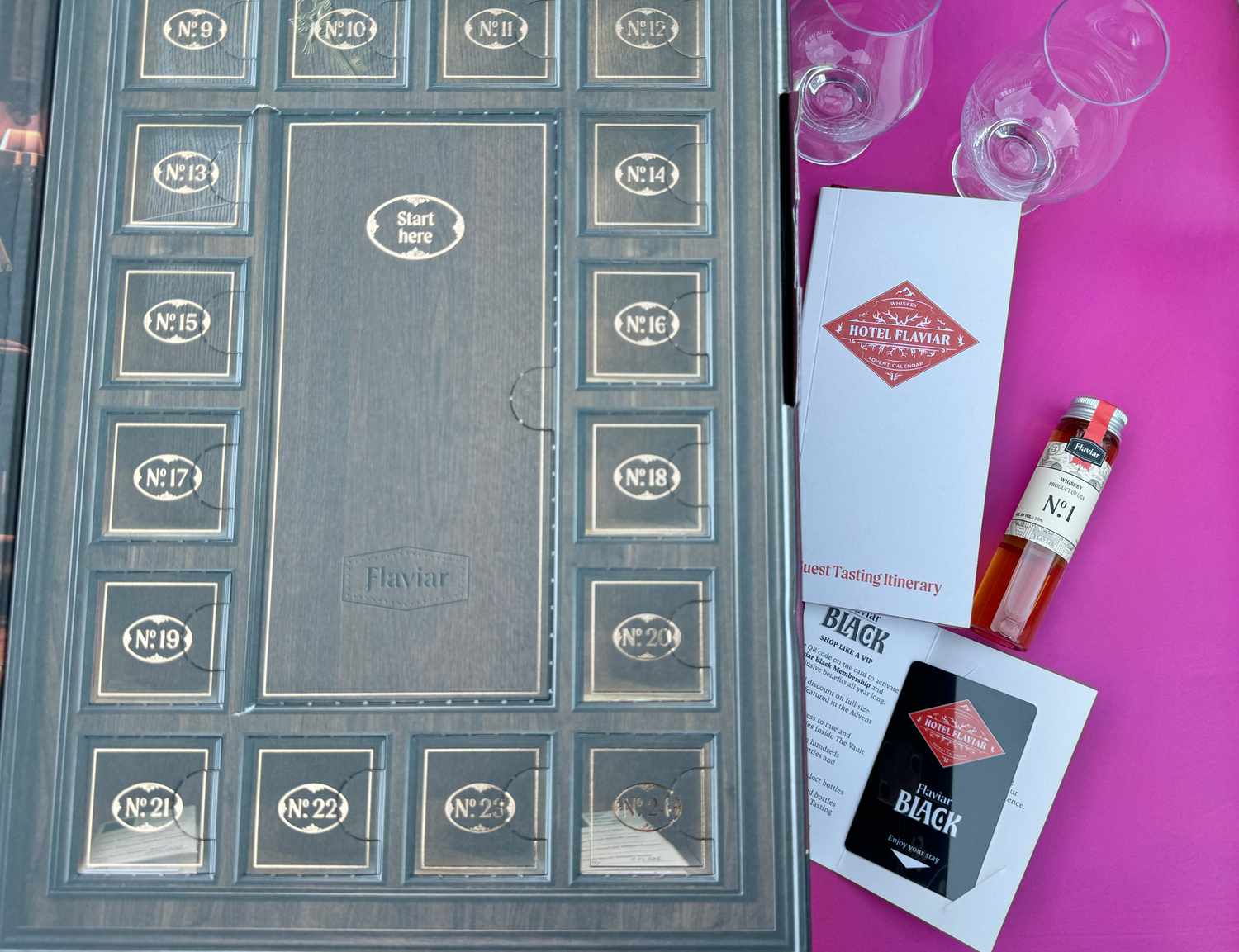 The Flaviar advent calendar with some of its materials out.