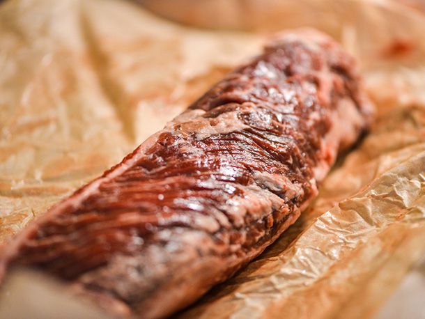 A piece of raw hanger steak on butcher paper