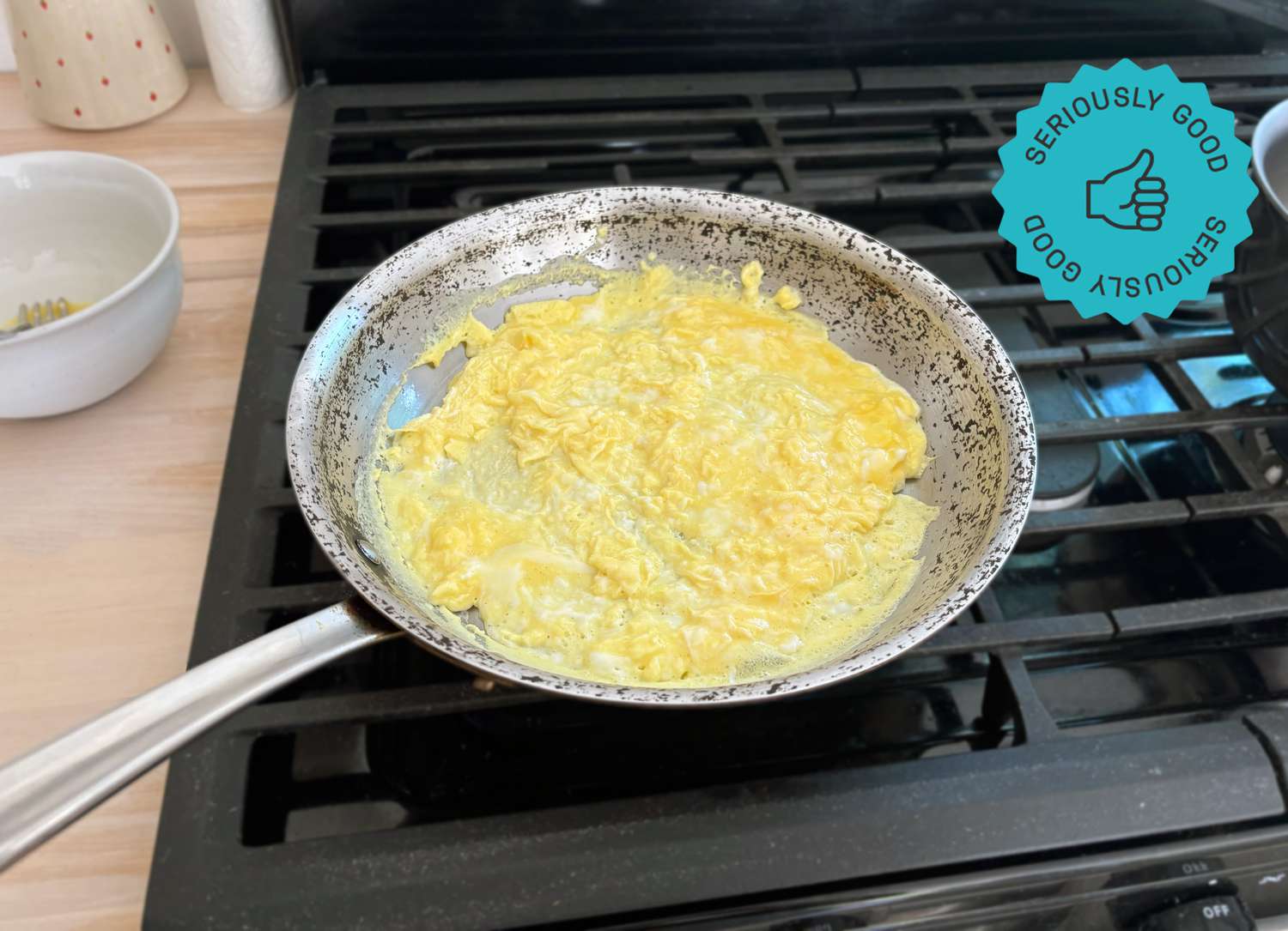 the all-clad D5 skillet with scrambled eggs inside it