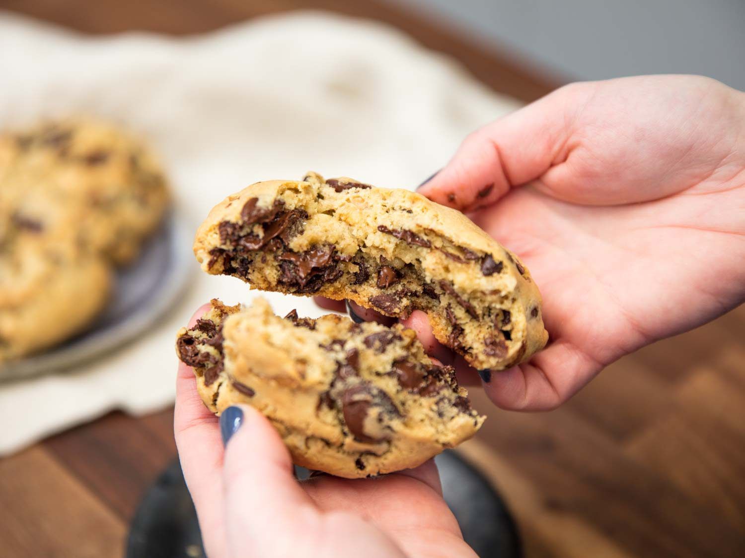 Breaking open a Levain Bakery-style super thick chocolate chip cookie.