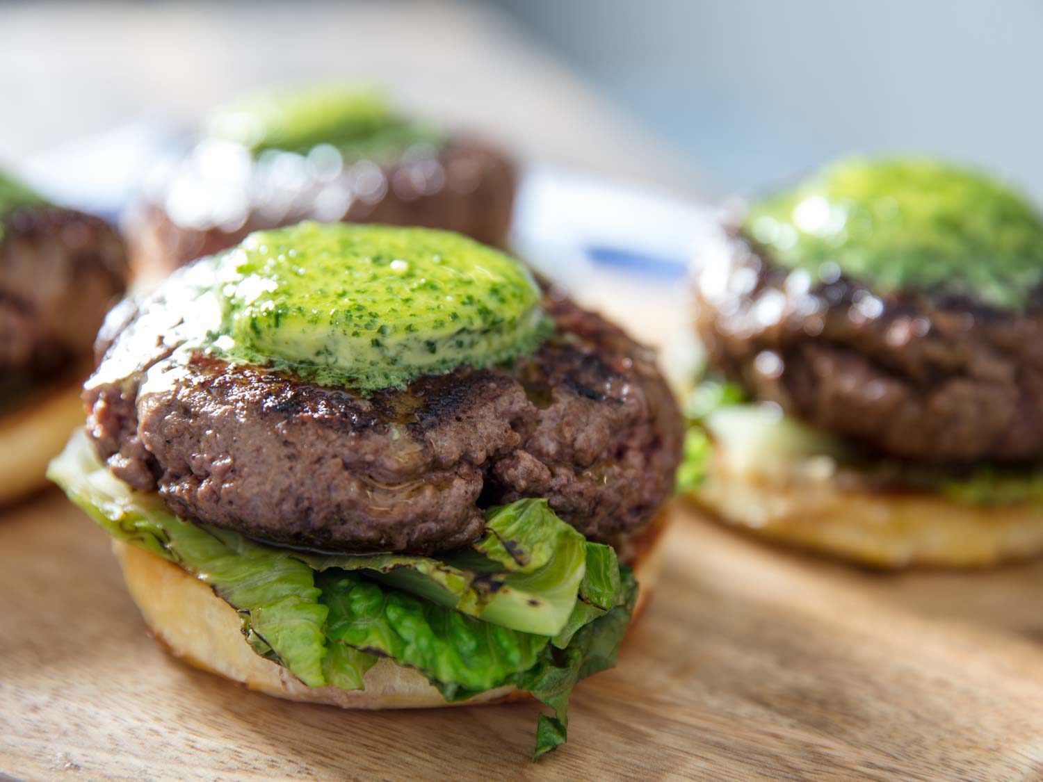 The maitre d'hotel butter melting on hot burger patties