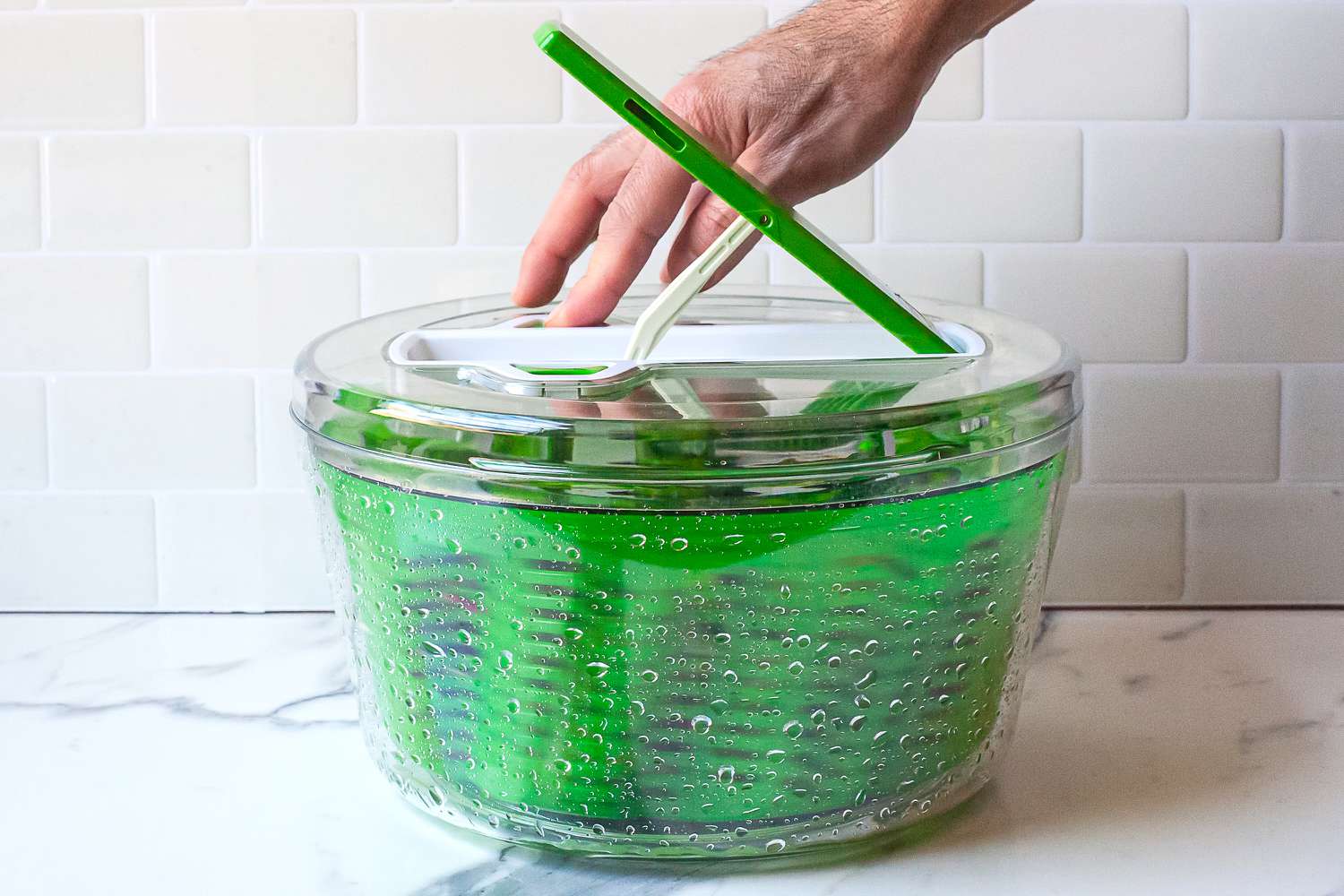 a person stopping the spin on the zyliss spinner