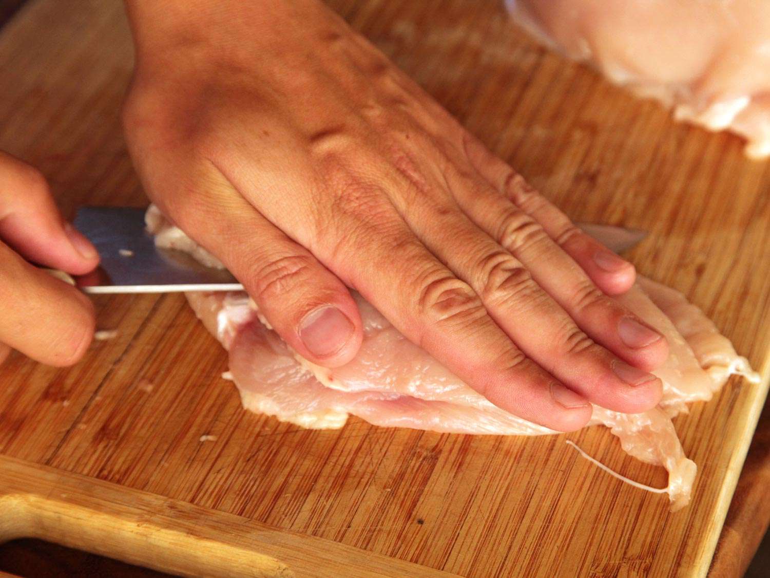 Splitting chicken breast horizontally in half