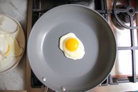 An egg cooking in the Caraway Nonstick Ceramic Frying Pan