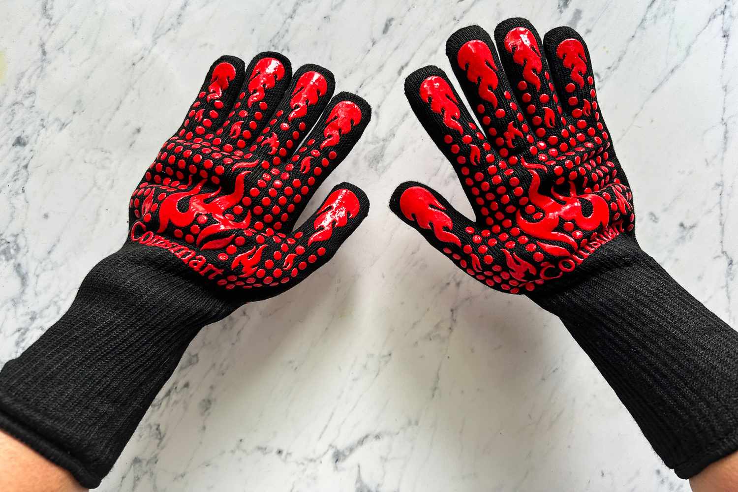 A person wears the Comsmart BBQ Gloves