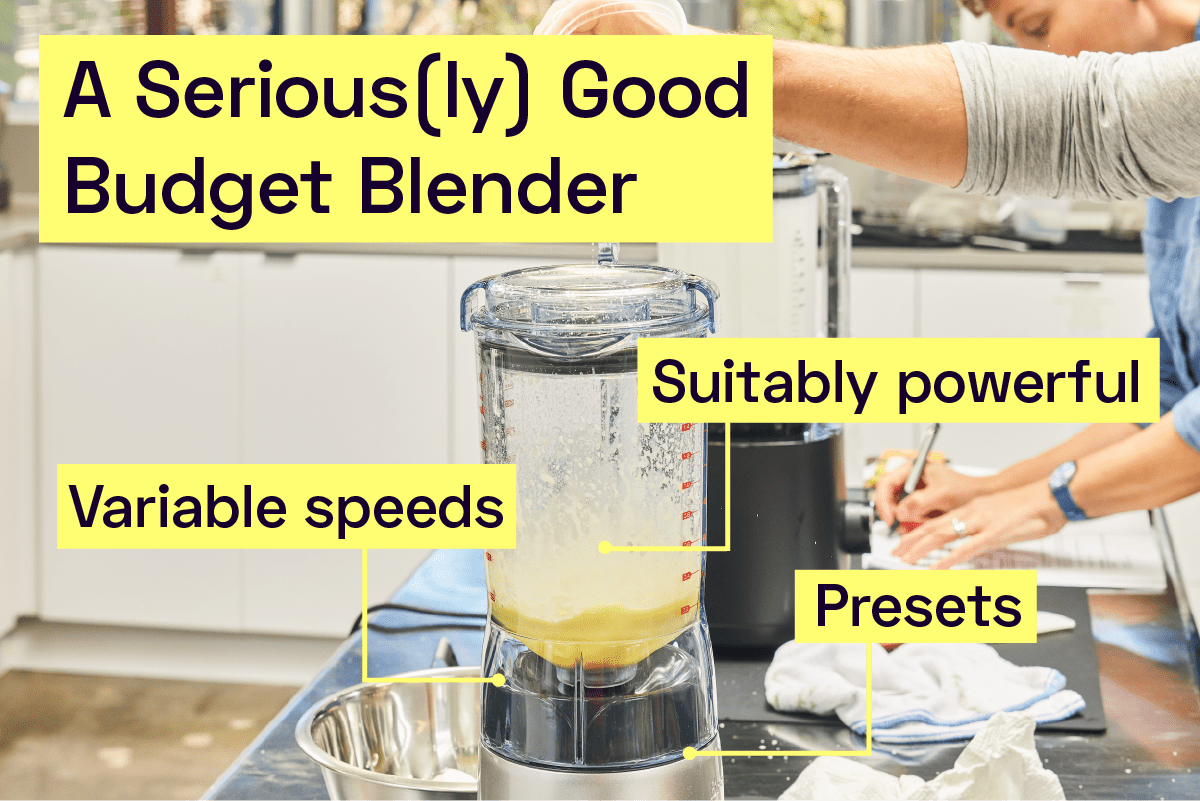 A person using a blender to make mayonnaise. 