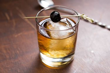 A Vieux Carre cocktail with a cherry garnish.