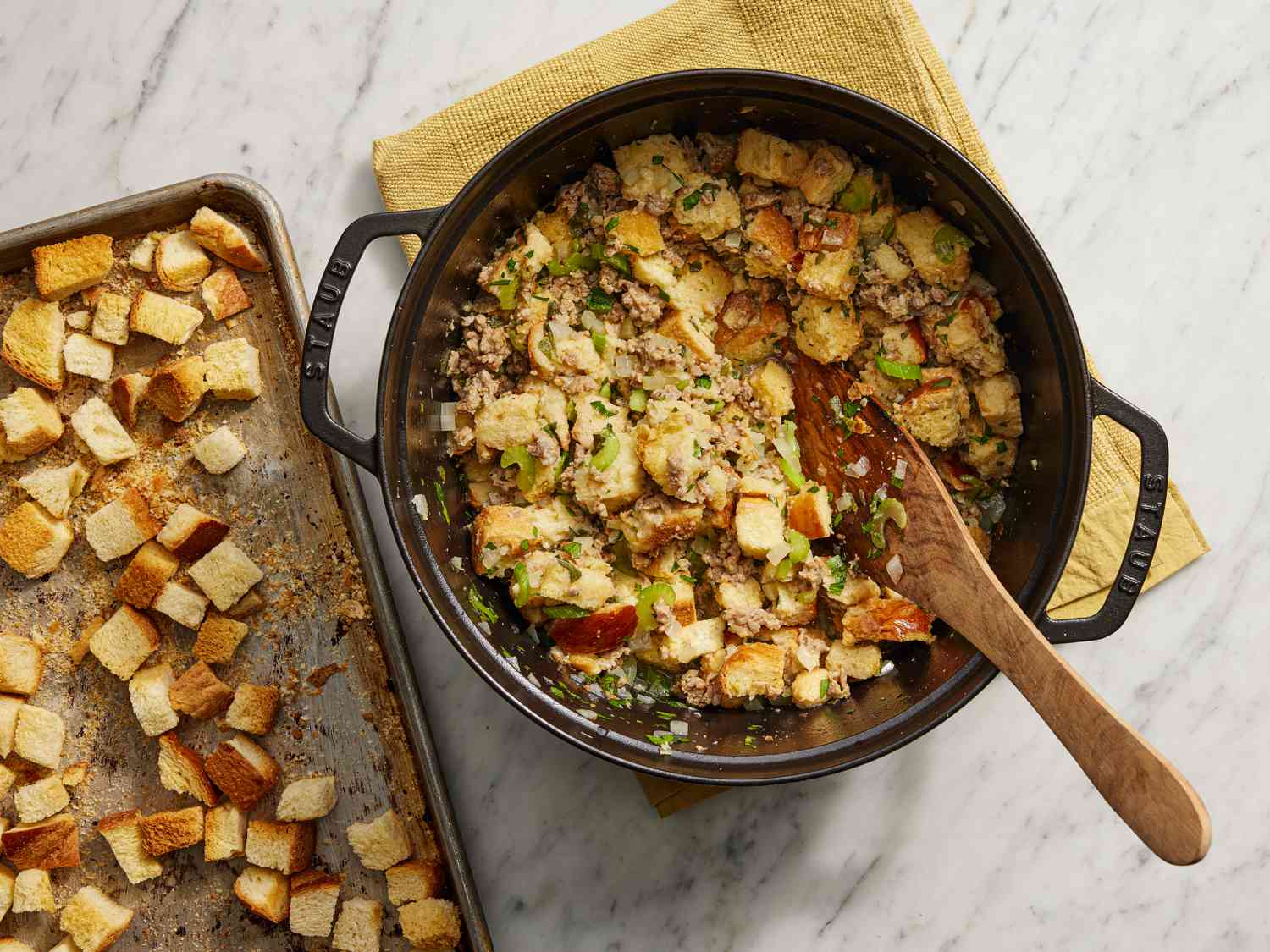 Mixing bread crumbs into sausage mixture