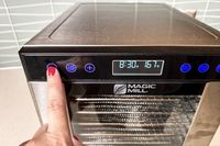 The Magic Mill food dehydrator with a focus on its digital display panel
