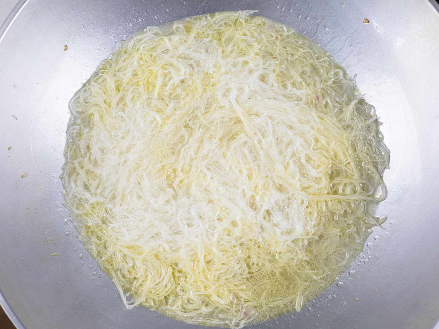 Rice noodles are cooked with the stock.