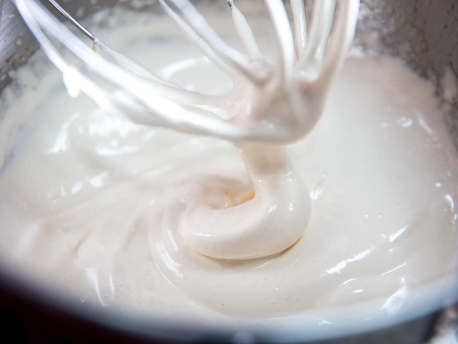 Closeup view of the whipped mixture, which has formed soft peaks.