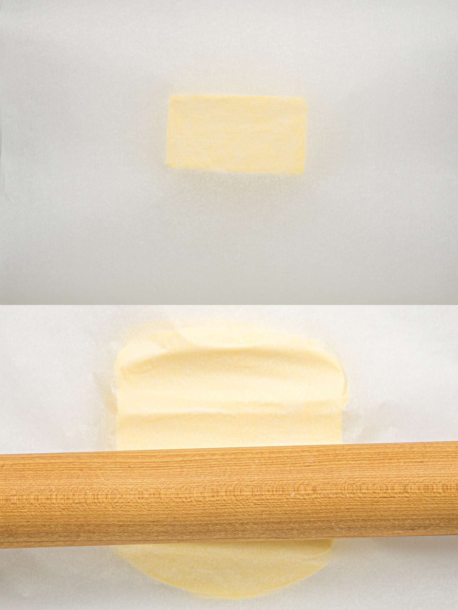 Butter being flattened with a rolling pin on parchment paper