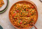 A skillet meal with chicken, chorizo, chickpeas, and vegetables