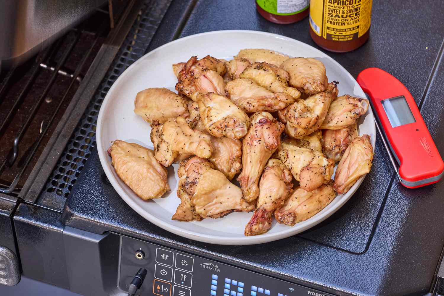 Wings cooked in the Traeger Woodridge Pro on a white plate