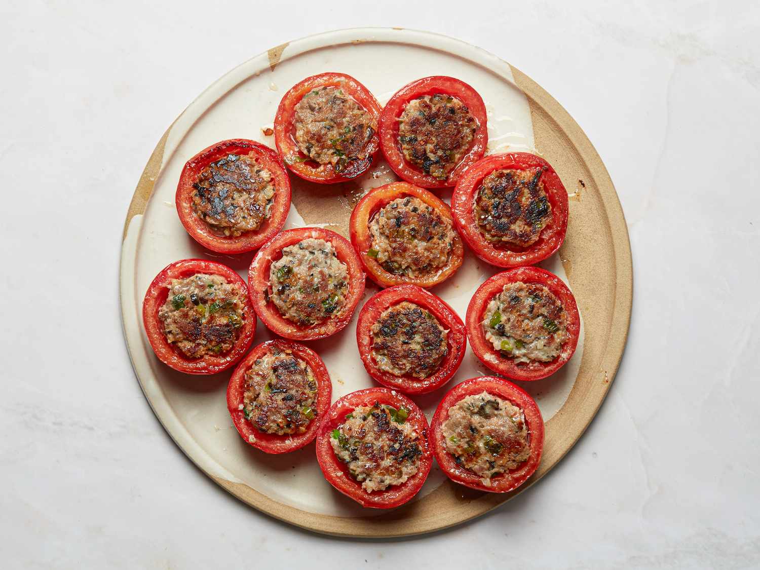 Plate of Vietnamese pork-stuffed tomatoes arranged in circles