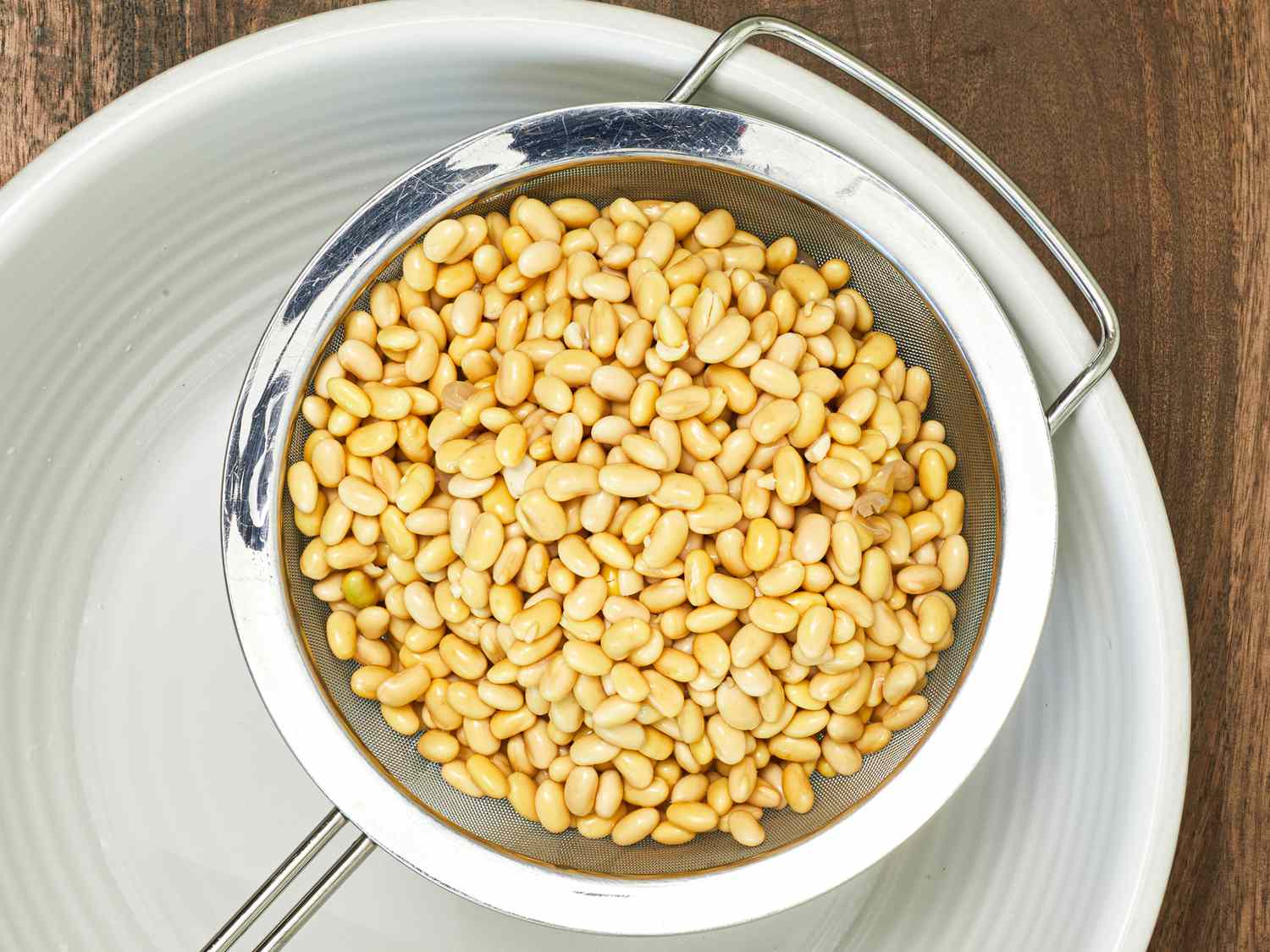 Cooked beans draining