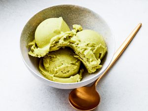 Overhead view of three scoops of avocado ice cream
