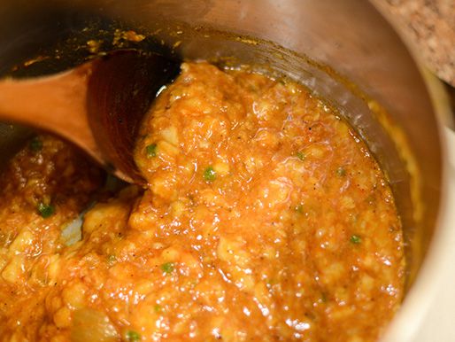 Stirring together all of the ingredients for banana ketchup.
