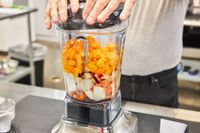 Fruit is blended in the Breville Stainless Steel Super Q Blender