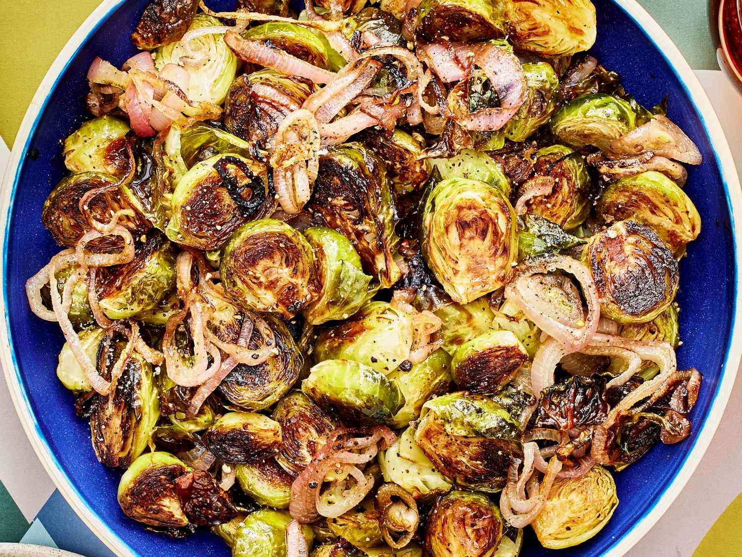 Roasted Brussels sprouts and shallots with a balsamic glaze in a bowl
