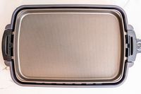 The Zojirushi electric griddle on a white marble countertop