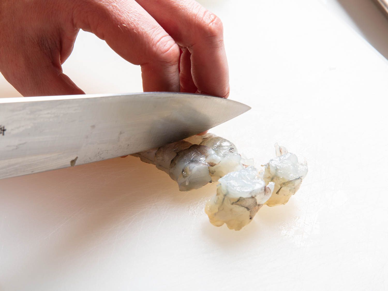 Cutting shrimp into pieces