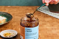 Milu Chili Crisp being scooped