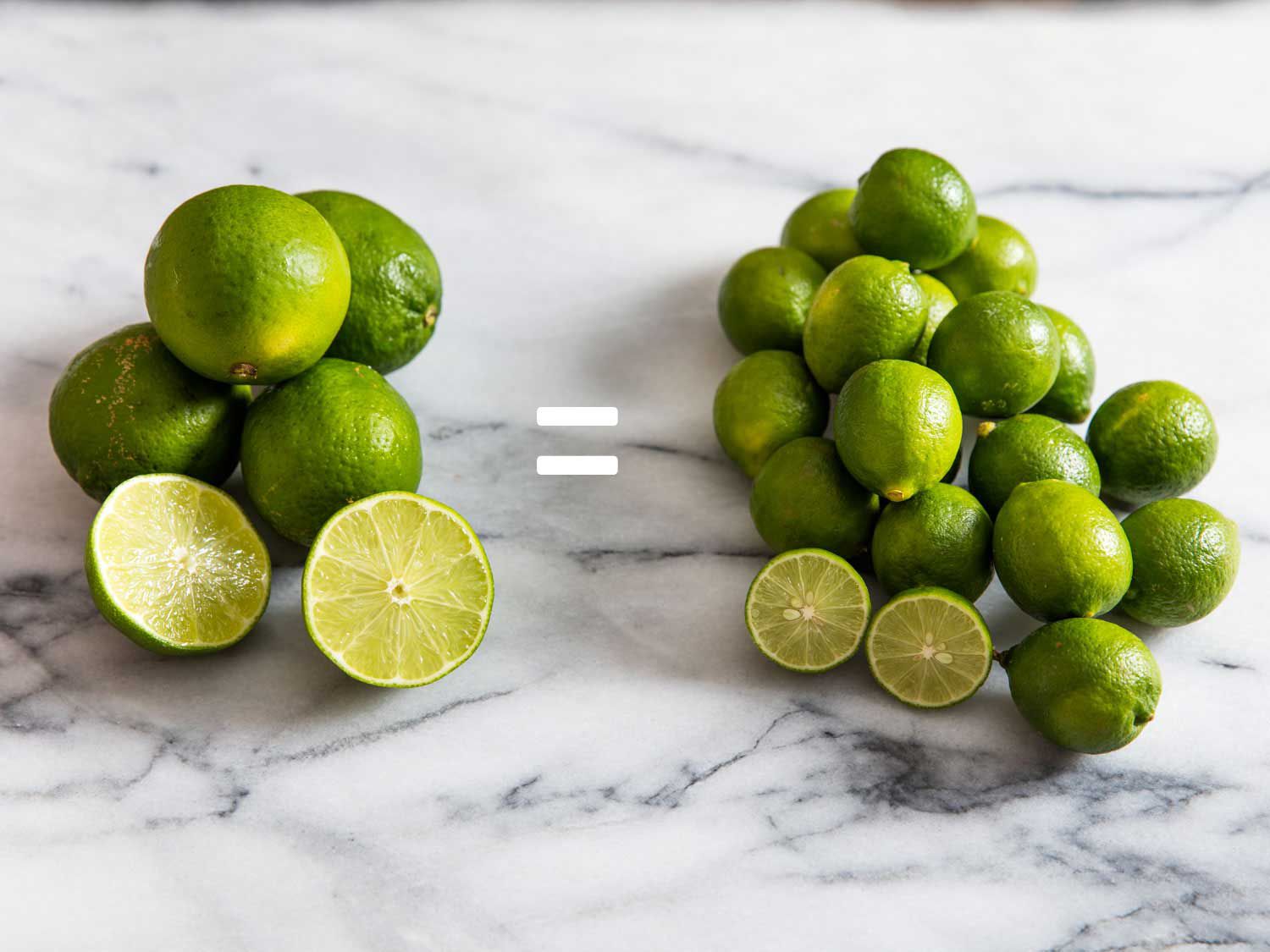 A pound of Persian limes on the left and a pound of Key limes on the right; they are on a marble countertop. 