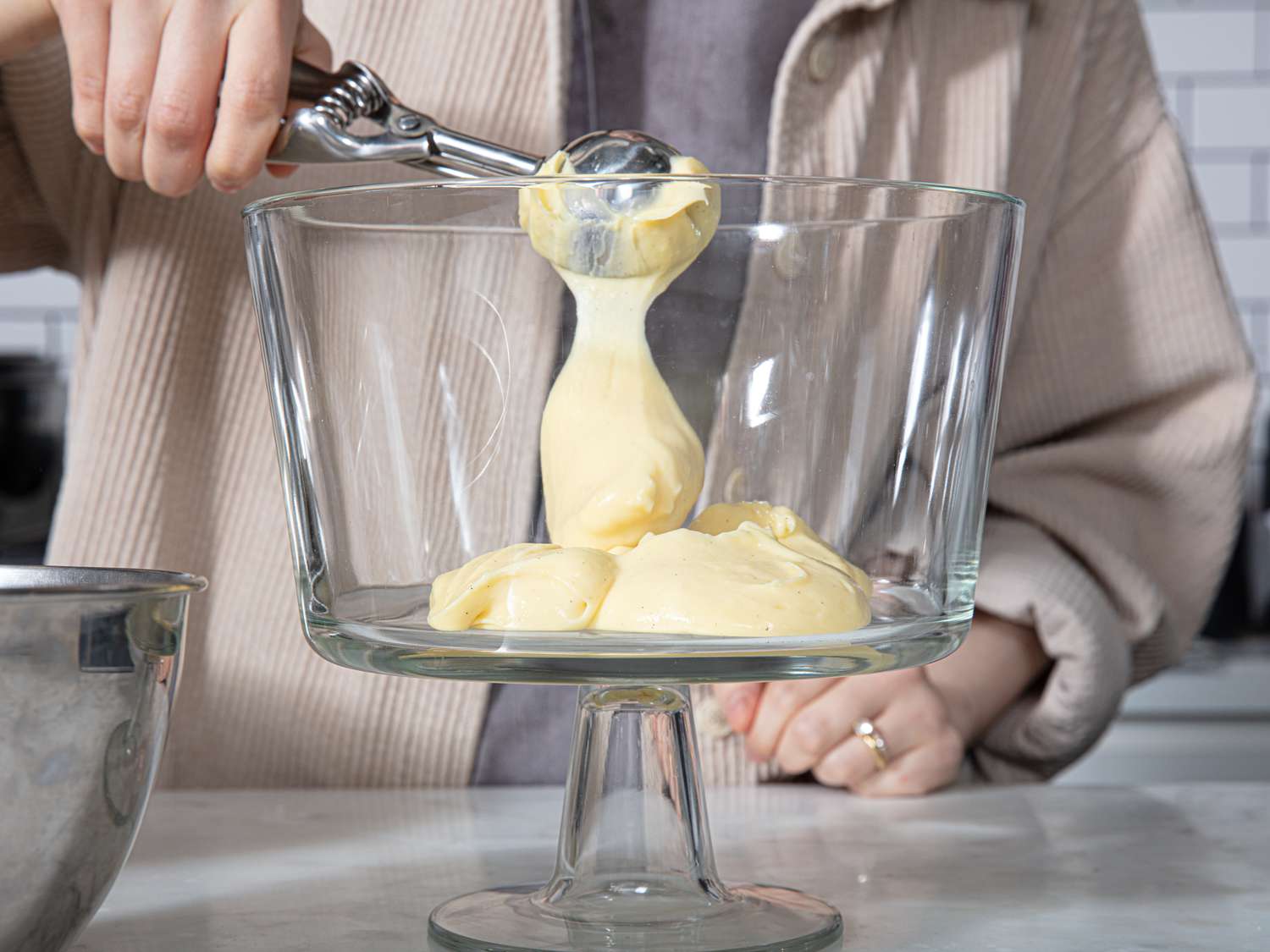 Side view of scooping pastry cream