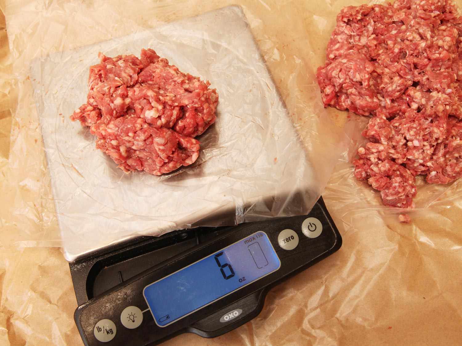 Portioning ground beef into 6-ounce patties using a scale for sous vide hamburgers.