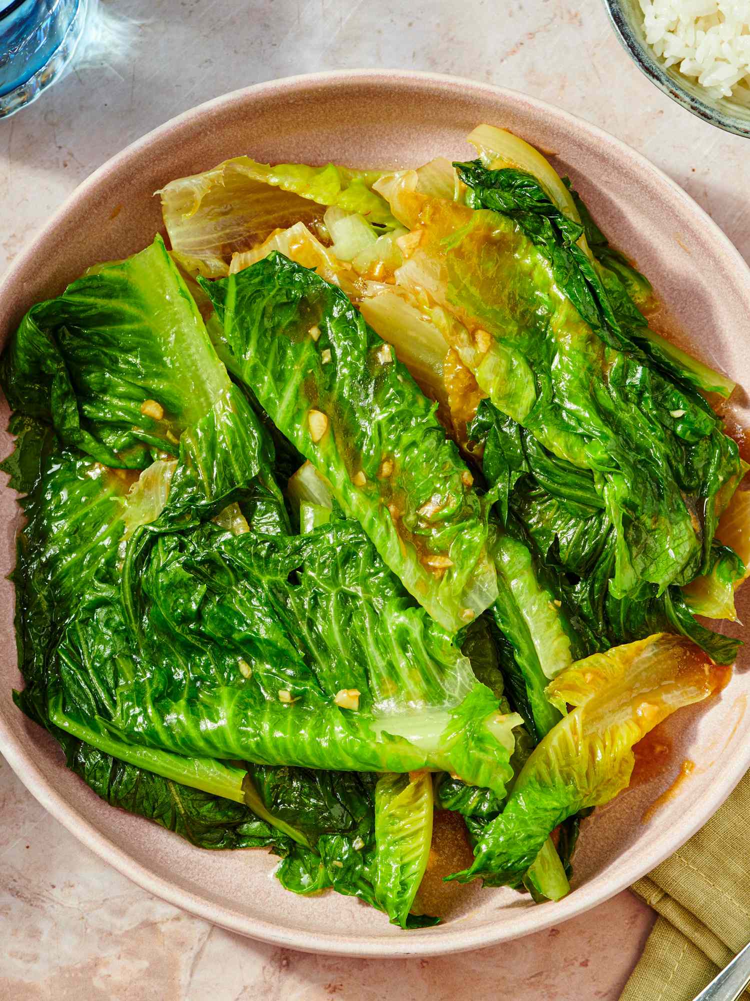 Cooked lettuce with oyster sauce served in a bowl