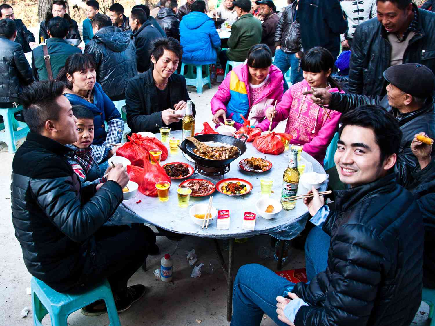 A family celebrated Chinese New Year by feasting around a table.