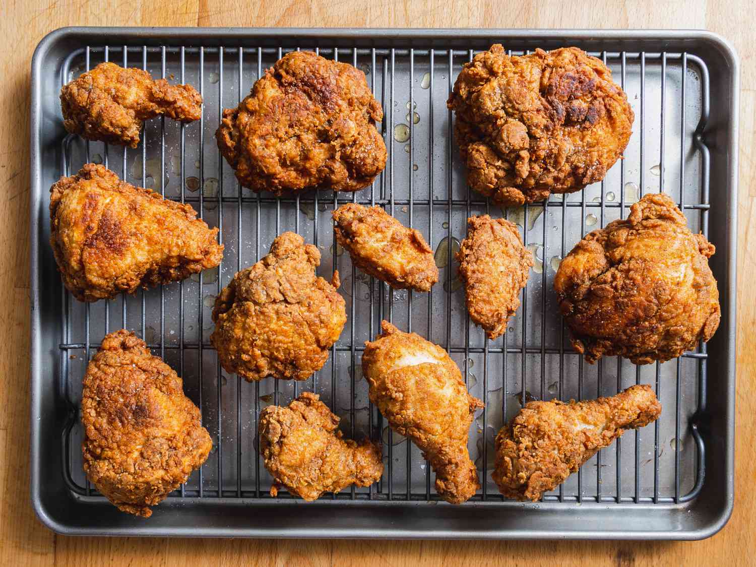 A tray of fried chicken on a wire rack