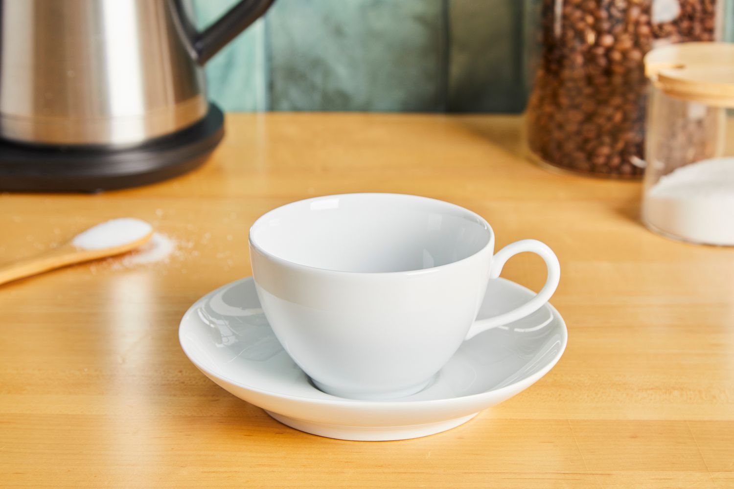 A coffee cup on a white saucer.