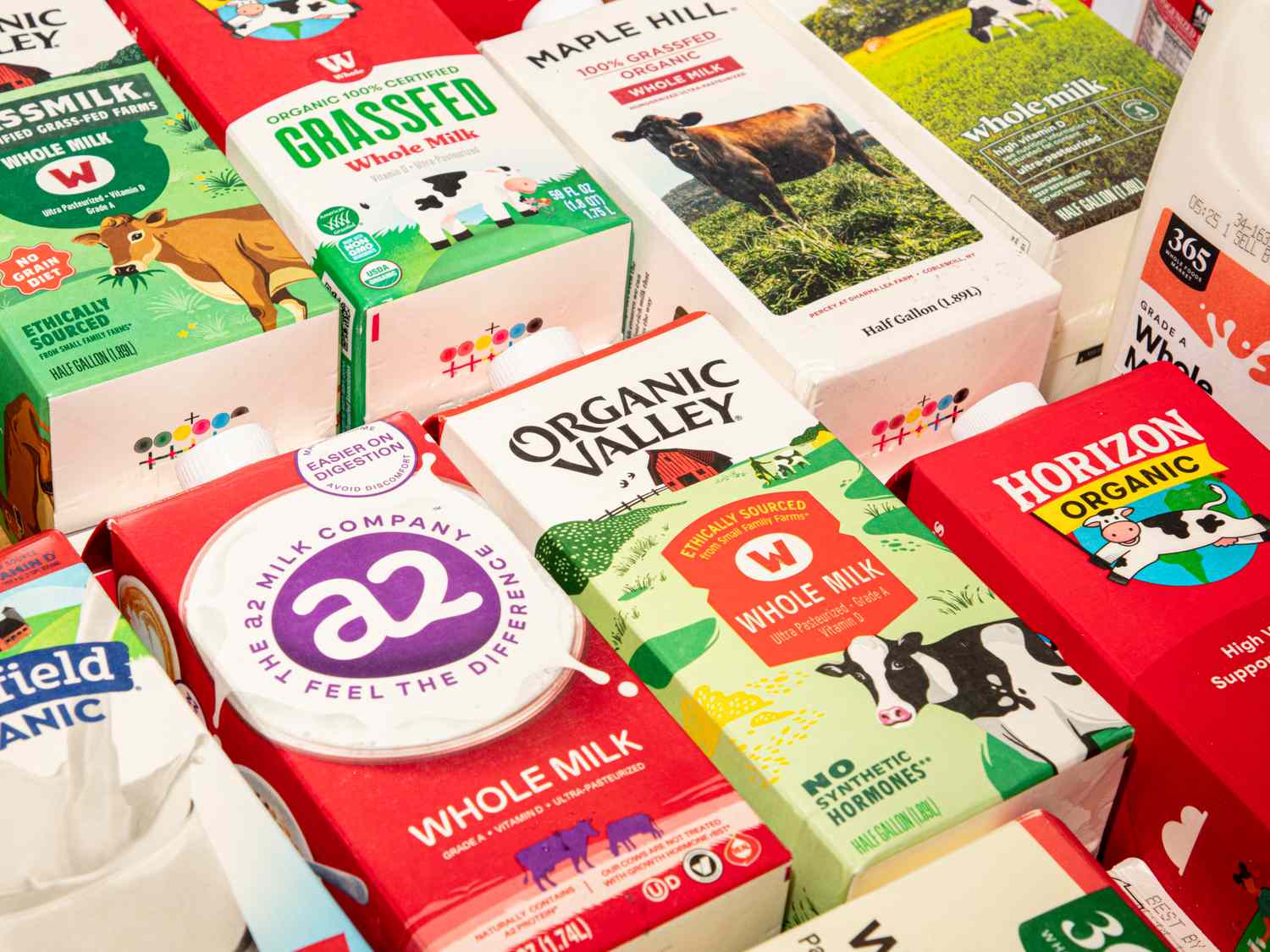 Various brands of milk cartons displayed including Organic Valley Horizon Organic and a2 Milk arranged in a grid