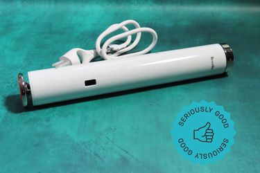 A sous vide machine on a blue surface