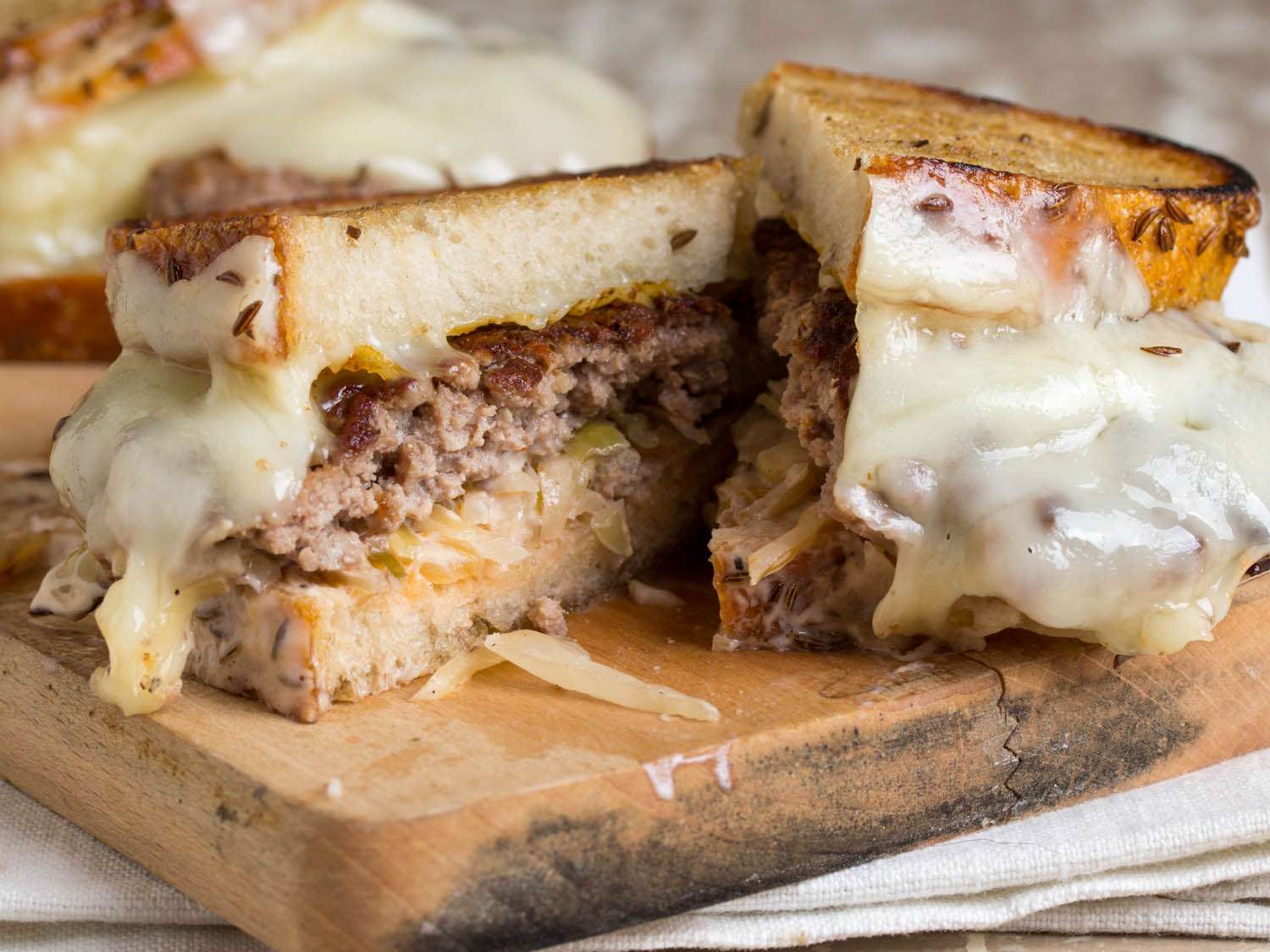 reuben burger cut in half